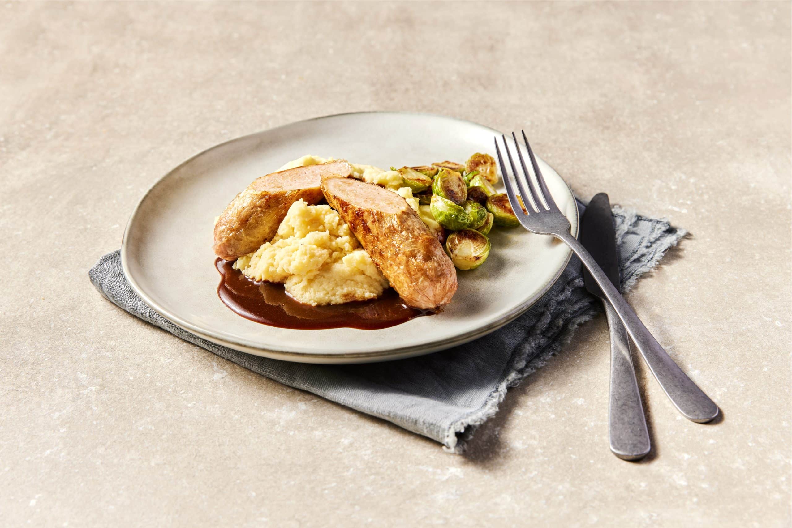 Redefine Bratwurst in Wine Sauce